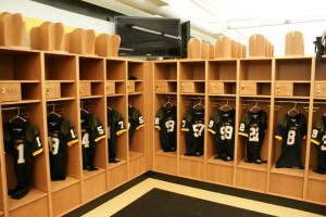 Locker room with wooden lockers and jerseys